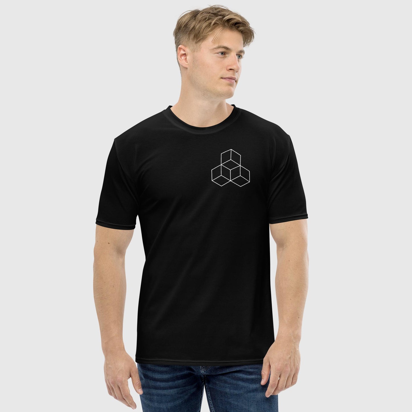 Man posing looking right wearing a black t shirt with a 3 cube design on the chest