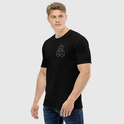 Man's side front pose looking right wearing a black t shirt with a 3 cube design on the chest