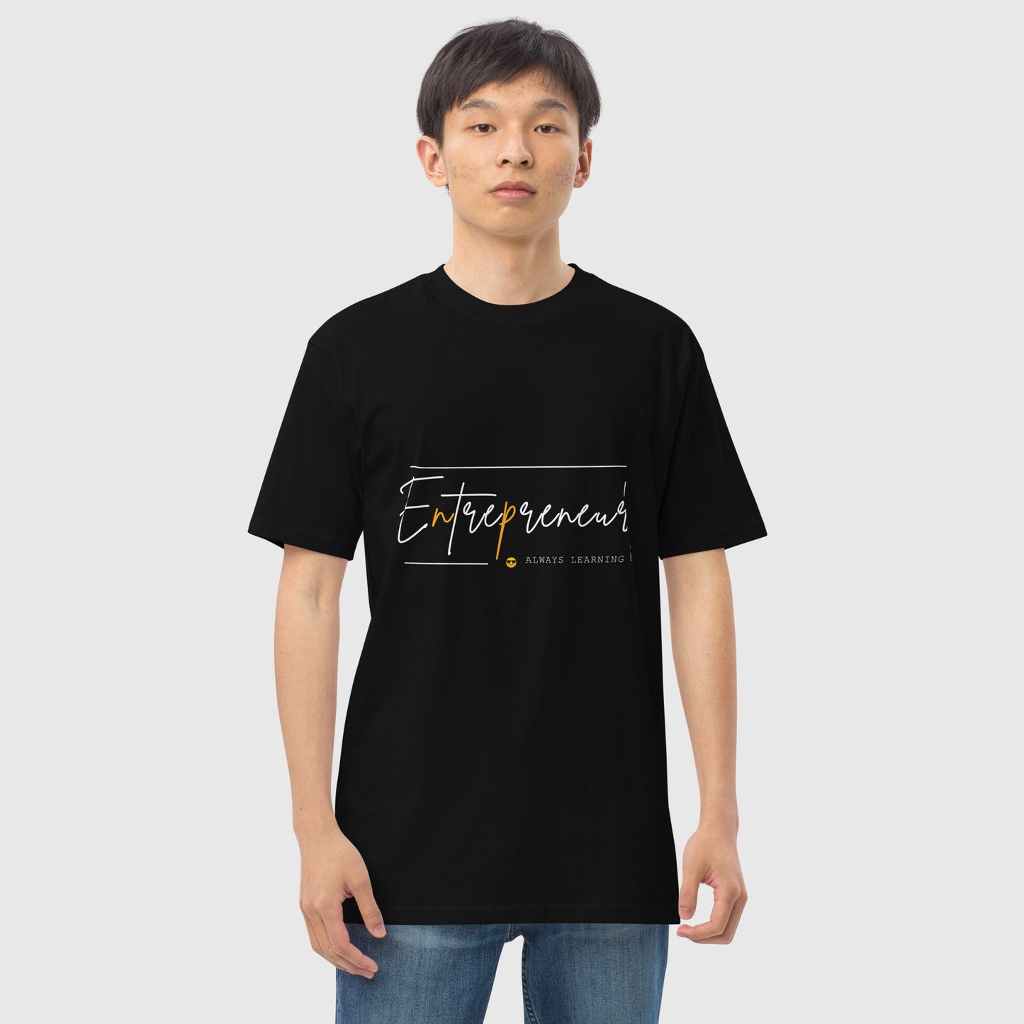 Man's front pose wearing a black t shirt with graphic print that says, entrepreneur mentality