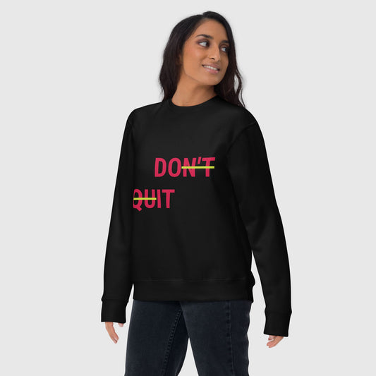 woman wearing a black don't quit, do it sweatshirt