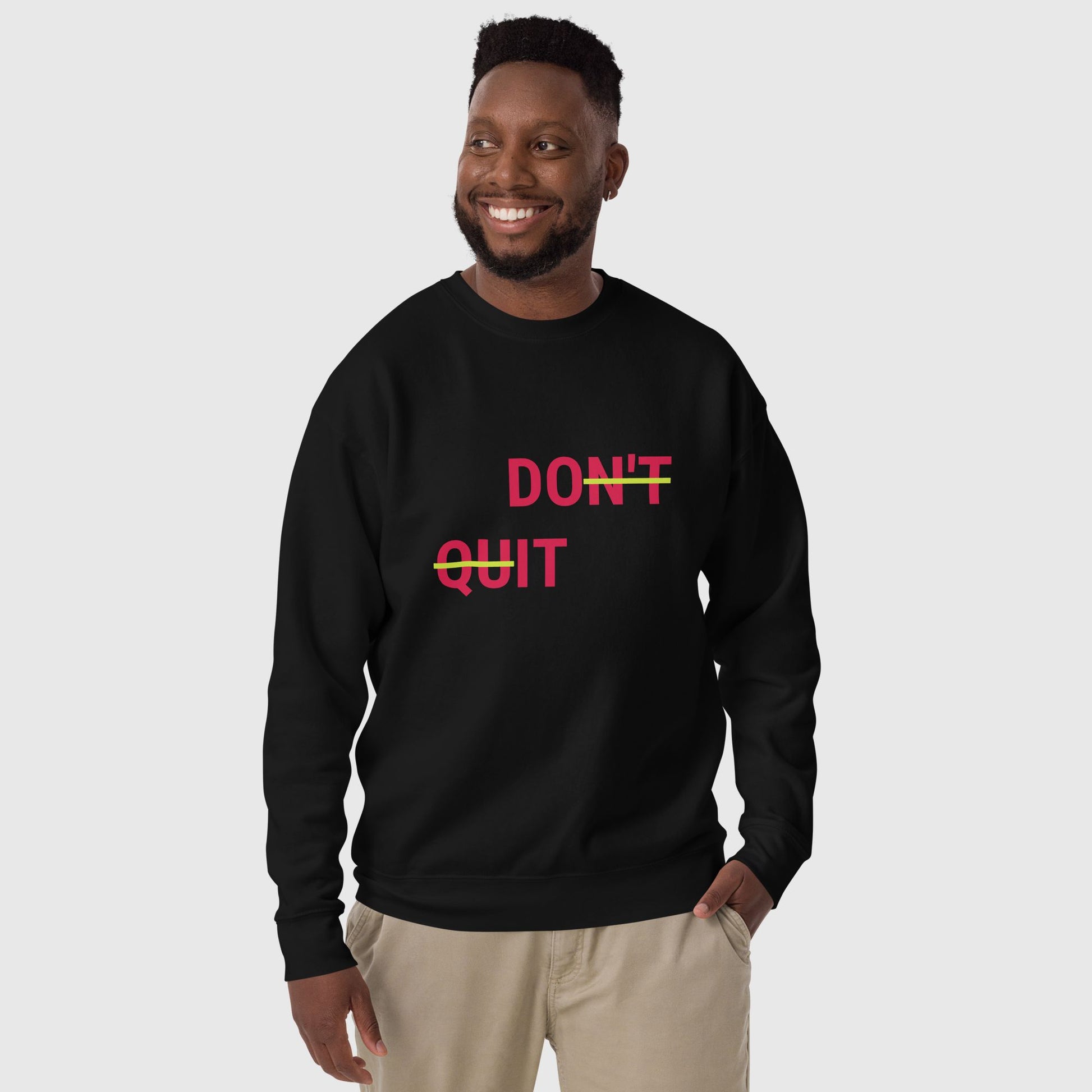 Man wearing a black don't quit, do it sweatshirt